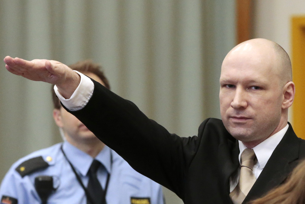 ap foto : lise aserud : anders behring breivik gestures as he enters a courtroom in skien, norway, on tuesday, march 15, 2016. breivik, the right-wing extremist who killed 77 people in bomb and gun attacks in 2011 arrived in court on tuesday for his human rights case against the norwegian government. (lise aserud, ntb scanpix via ap)  norway out norway ou norway breivi automatarkiverad