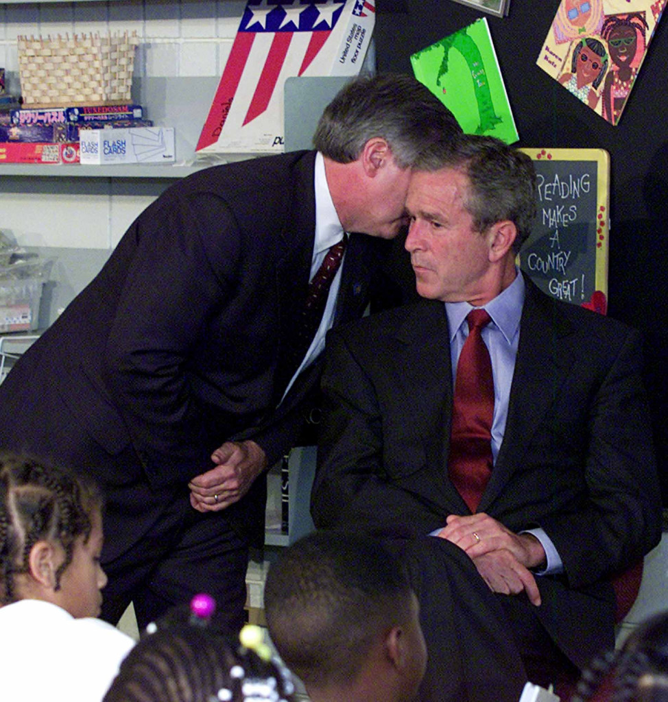 foto : doug mills : file - in this tuesday, sept. 11, 2001 file photo, chief of staff andy card whispers into the ear of president george w. bush to give him word of the plane crashes at the world trade center, during a visit to the emma e. booker elementary school in sarasota, fla. (ap photo/doug mills)