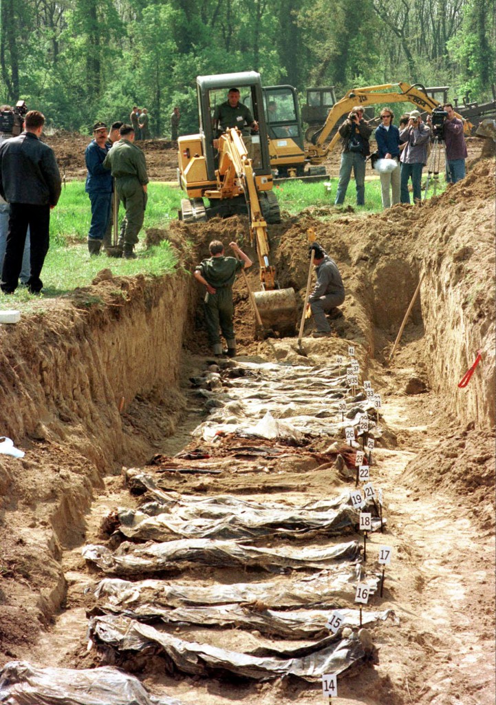 ap foto : ap : editors note graphivc content  file - this is a tuesday, april 28, 1998 file photo of remains of victims are exhumed from a mass grave in ovcara, near vukovar . the victims are believed to be mostly croat soldiers and civilians killed during the october 1991 siege of vukovar or rounded up and executed by the yugoslav army and serb paramilitary troops after the city s fall three months later.  goran hadzic the last fugitive sought by the u.n. balkan war crimes tribunal was arrested by serbian authorities wednesday july 20, 2011, answering intense international demands for his capture and boosting the country's hopes of becoming a candidate for european union membership.  in the wars crimes  indictment hadzic is accused of responsibility for the 1991 leveling of vukovar, said to be the first european city entirely destroyed since world war ii. in one of the worst massacres in the croatian conflict, serb forces seized at least 264 non-serbs from vukovar hospital after a three-month siege of the city, took them ty editors note:  graphic content tuesday, april 28, 199 serbia war crimes hadzi automatarkiverad